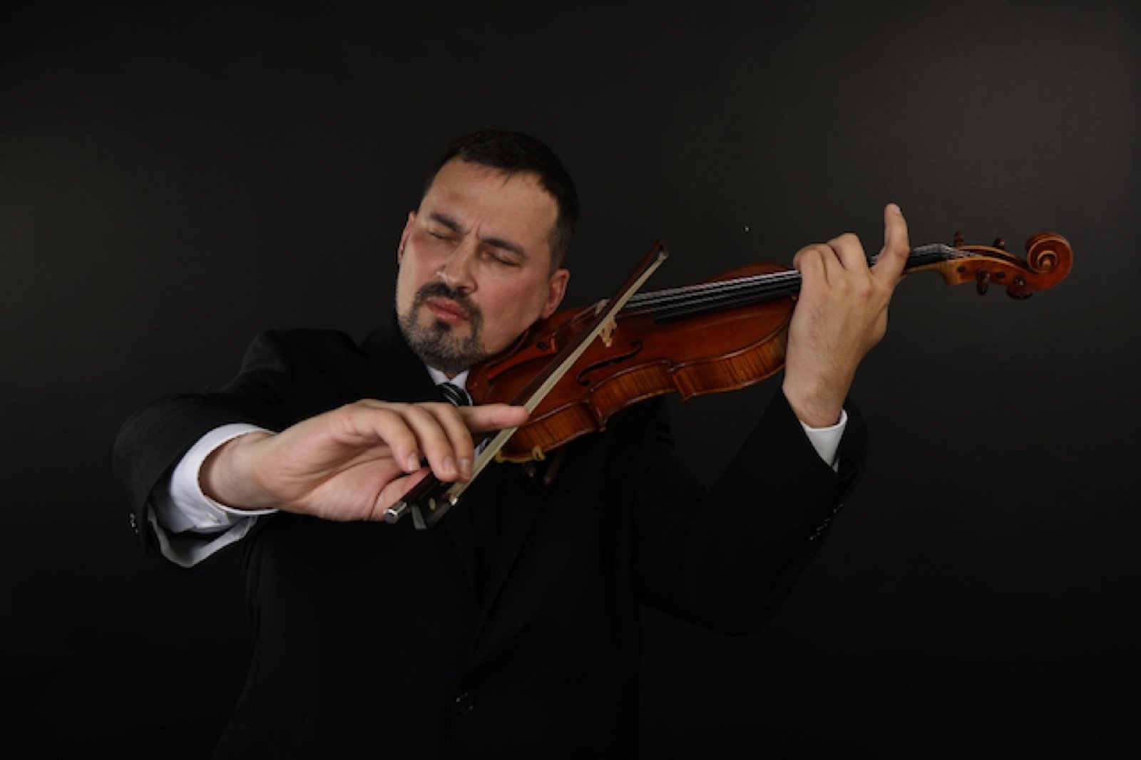 Dr. Anton Yertesky playing violin