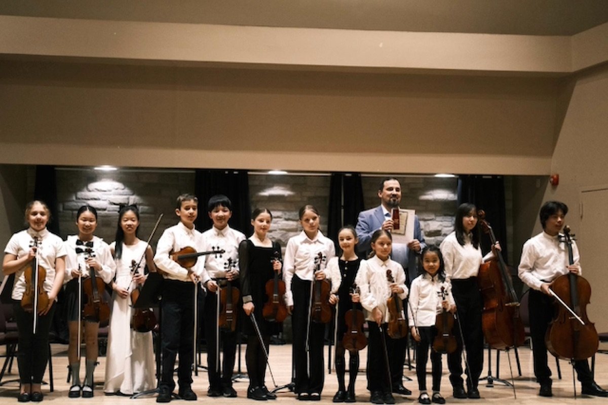 Nova Youth Chamber Orchestra students performing on stage